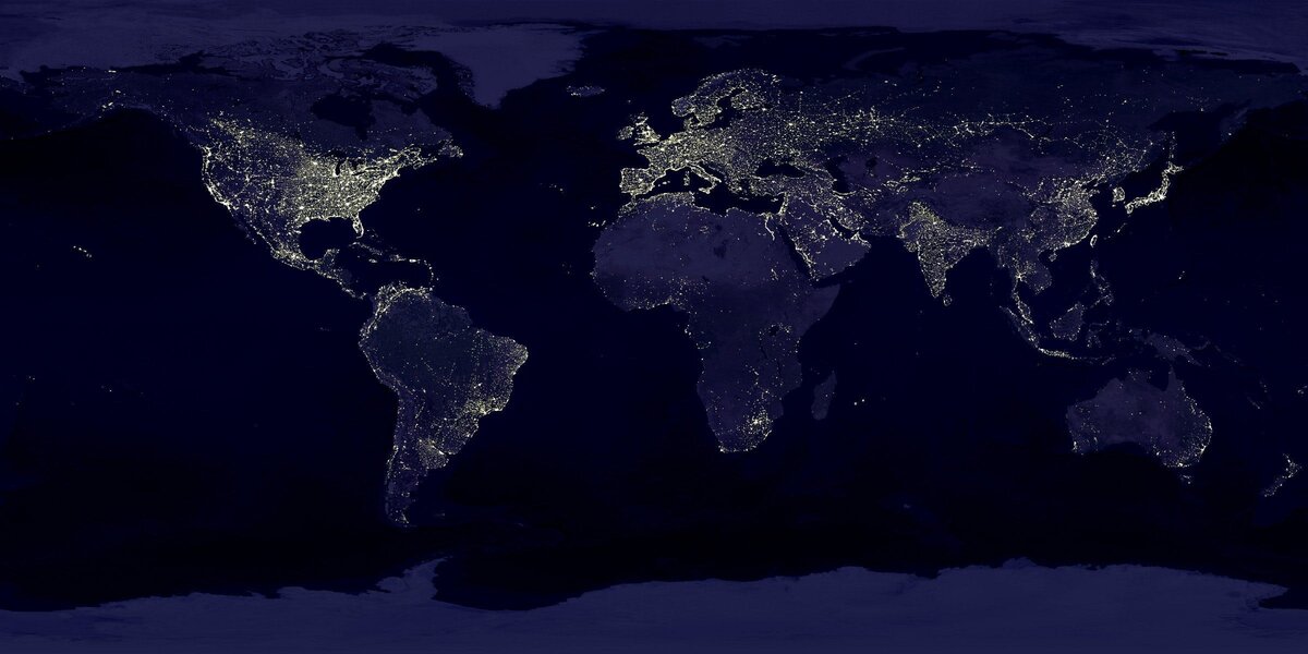 An image of the world at night with lights representing electricity