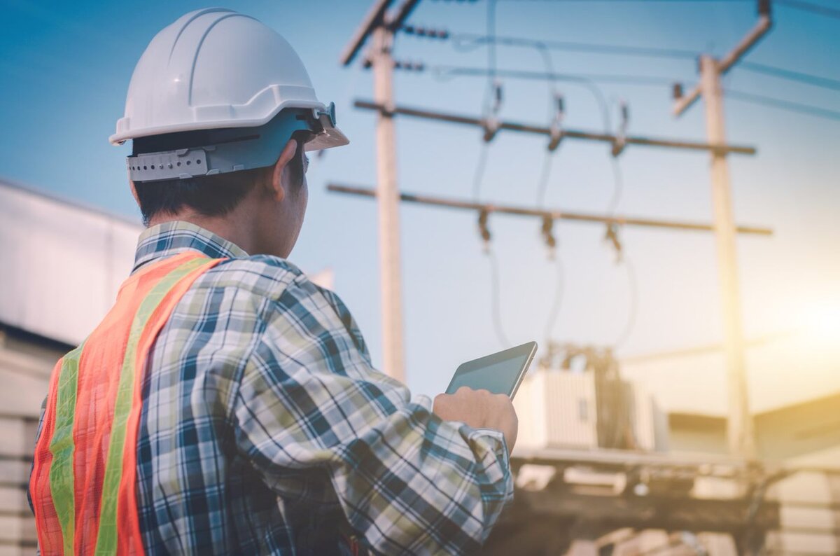 Man holding tablet on site