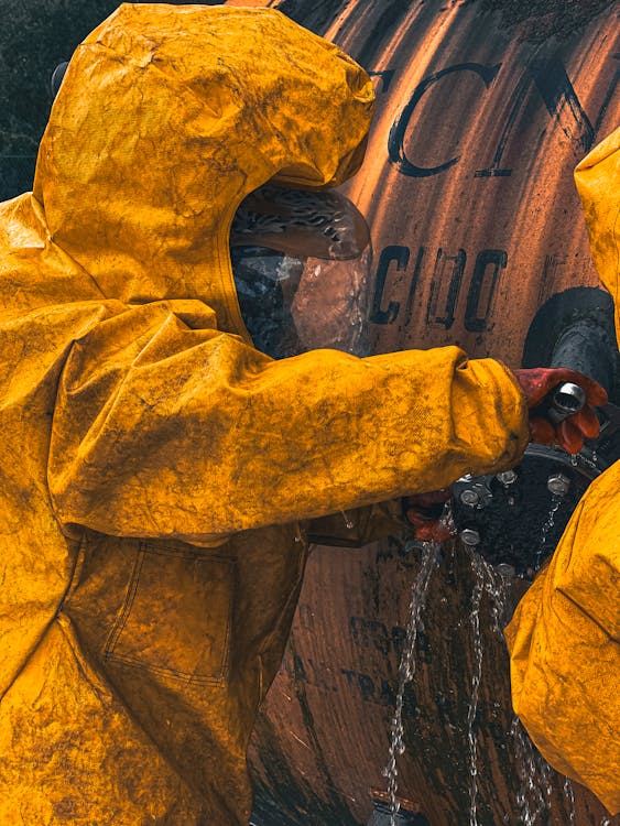 Free Photo Of Hazmat Suit Technicians Securing Leak In Barrel
