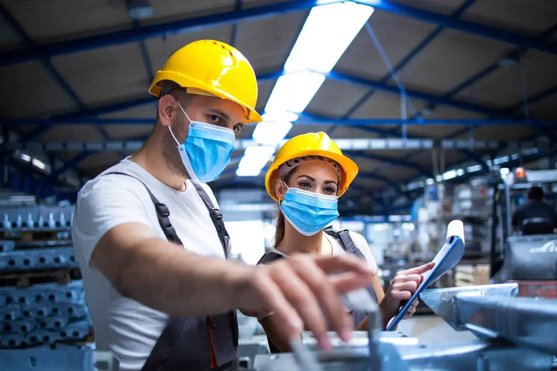 Industrial Workers With Face Masks Protected Against Corona Virus Discussing About Metal Parts Factory Small 2