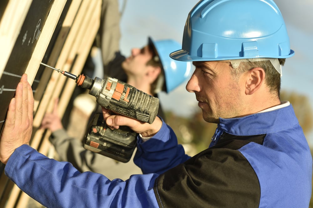 Construction20worker20using20electric20drill20on20building20site-1