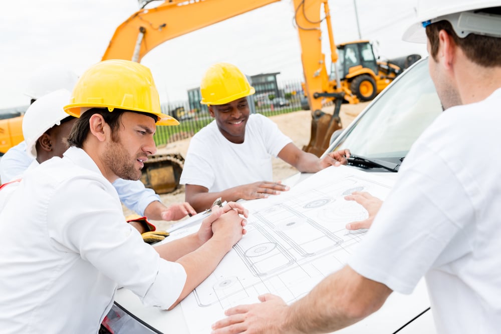 Group20of20civil20engineers20working20on20a20construction20and20looking20at20blueprints-1