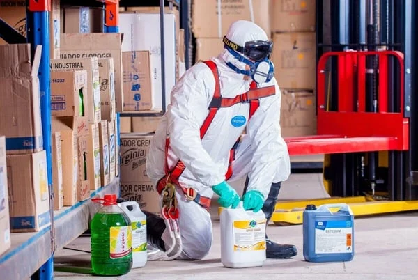 Man20in20white20jumpsuit20with20chemicals-1