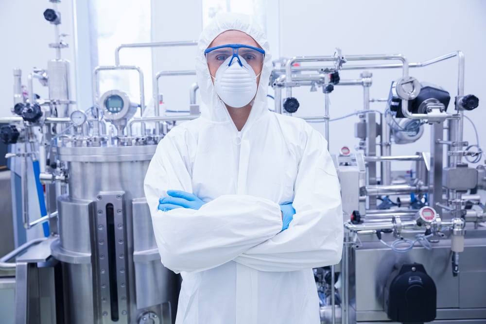 Scientist20in20protective20suit20standing20with20arms20crossed20in20the20factory-1