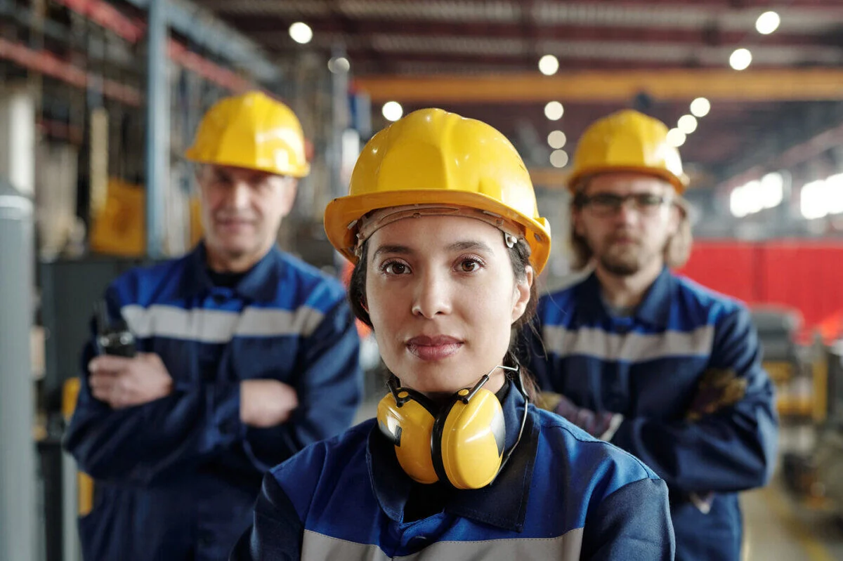Three20workers20wearing20blue20suits20and20yellow20constr-7