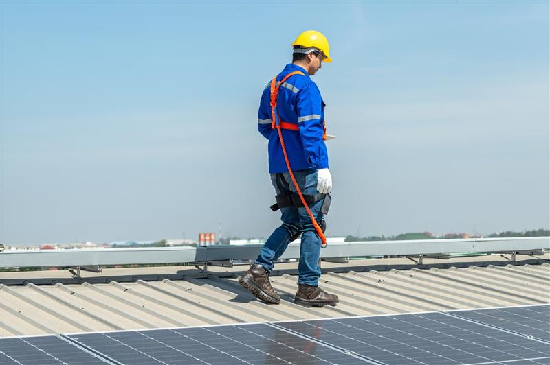 Man Walking Along Rooftop