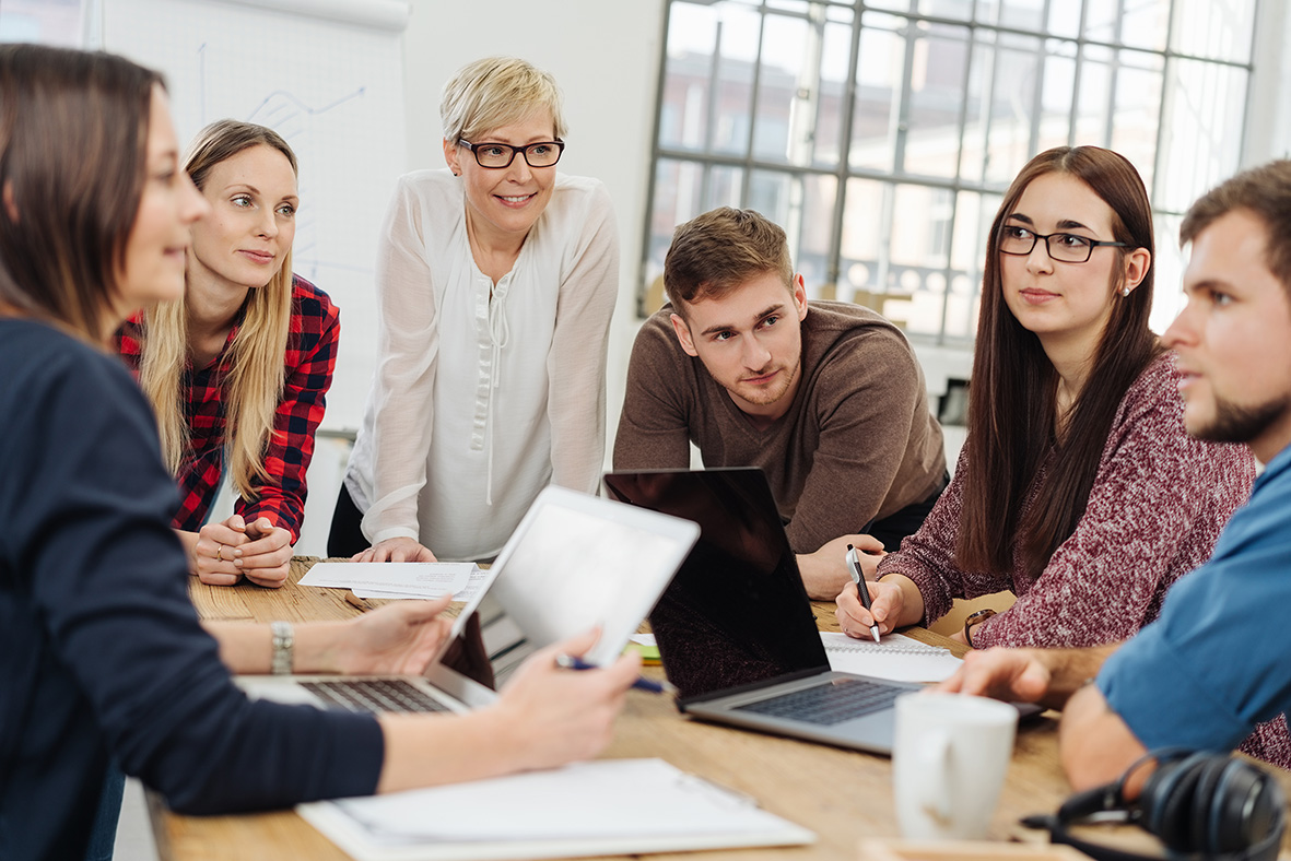 Team Members Meeting In Office