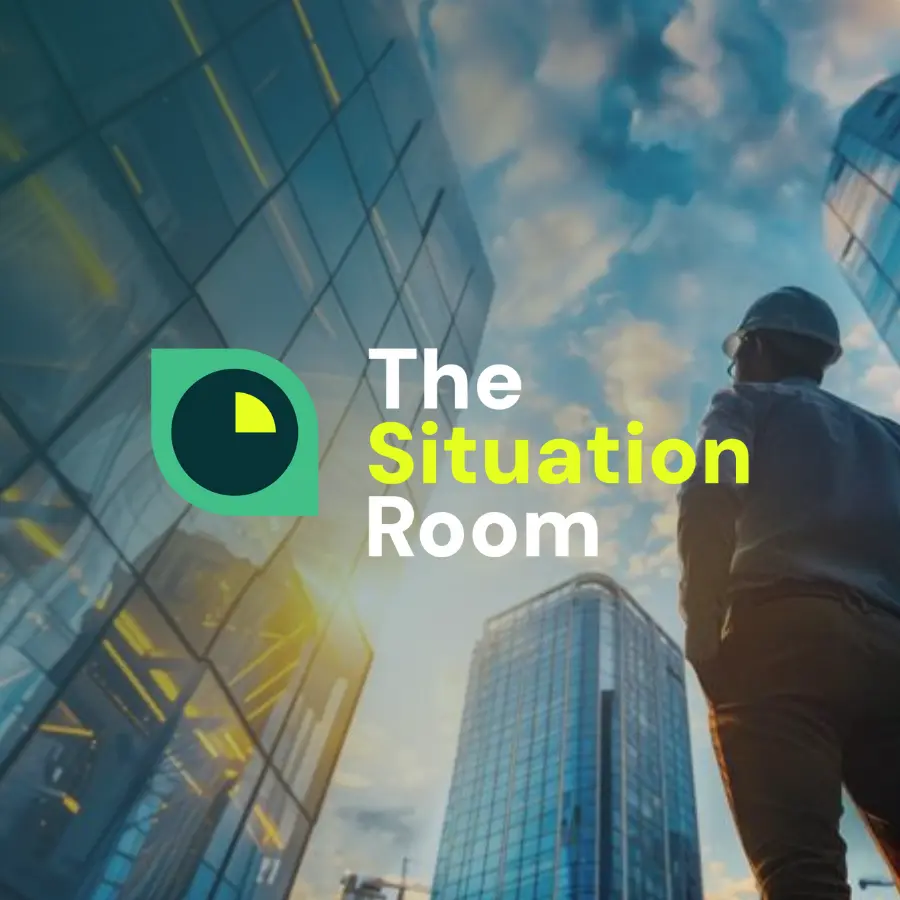 Man With Hardhat Looking At Building