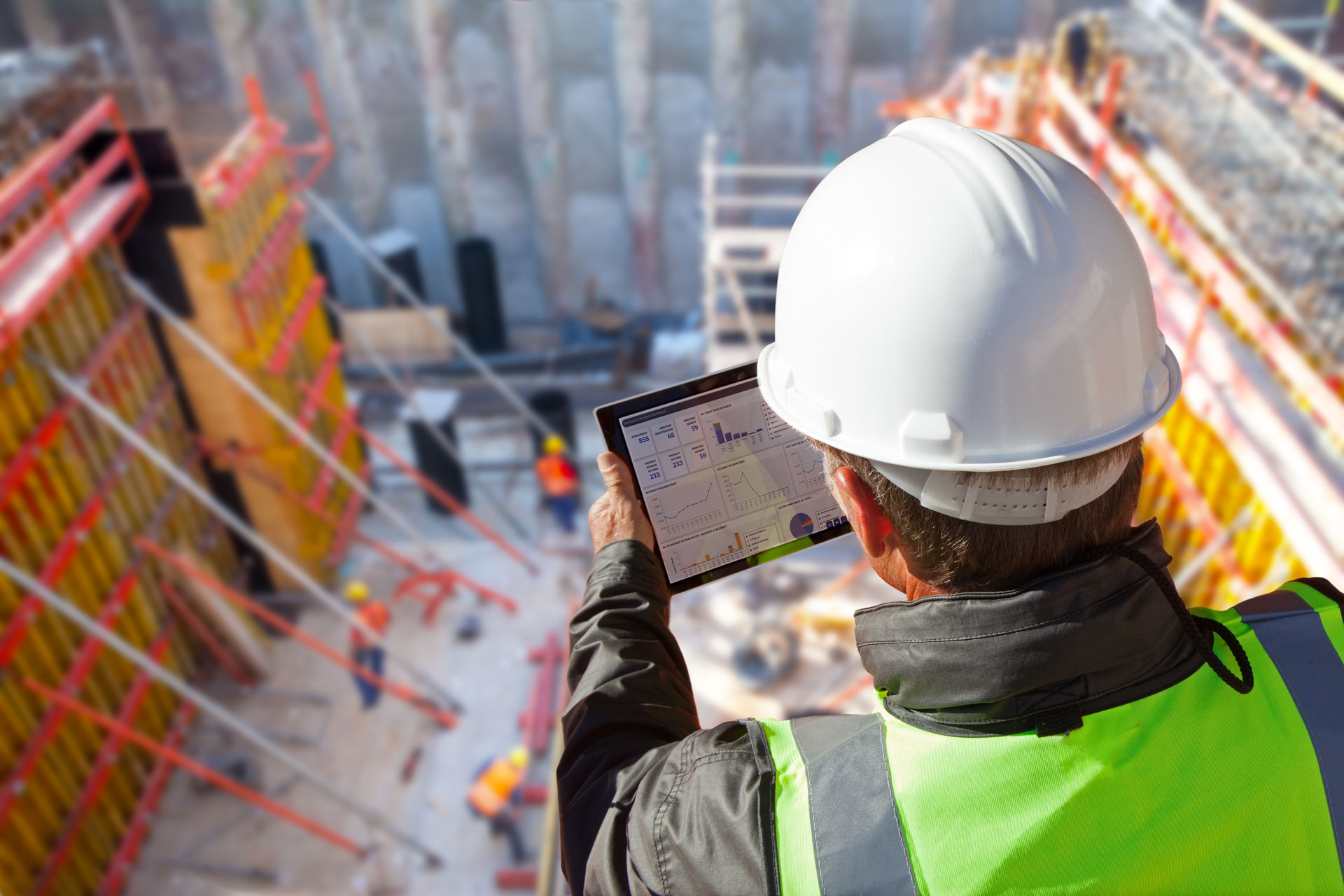 Man at construction site with tablet