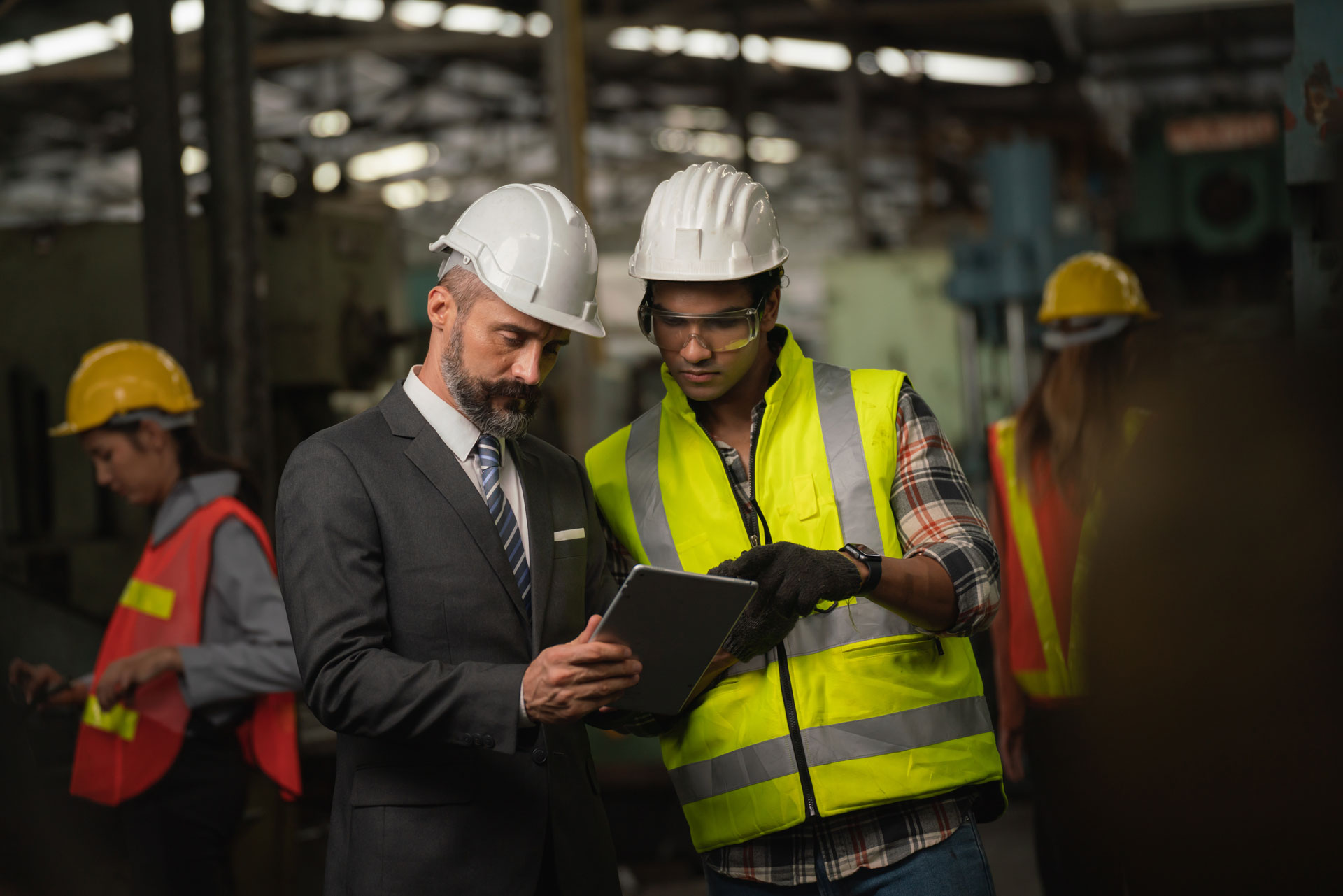 Manager Worker Looking At Tablet