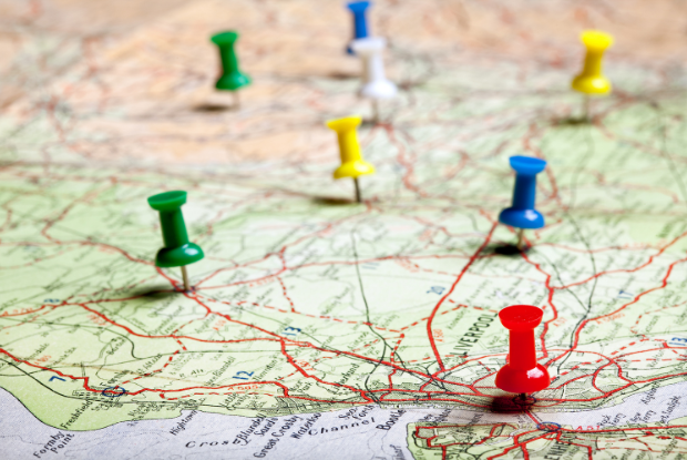 A map with many colored pins stuck in it
