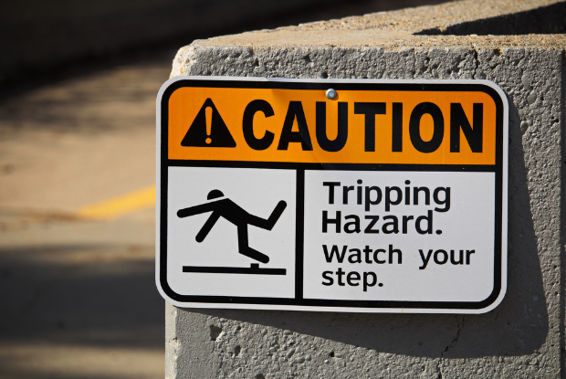 A photo of a warning sign for a tripping hazard
